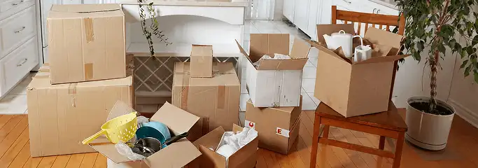 Packed moving boxes and household items in a kitchen before move-out or move-in cleaning, Cincinnati, OH.